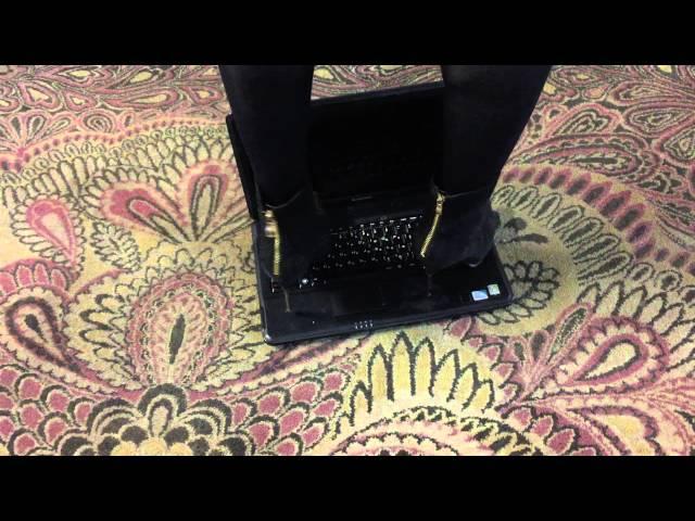 Girl trample laptop with metal high heel boots