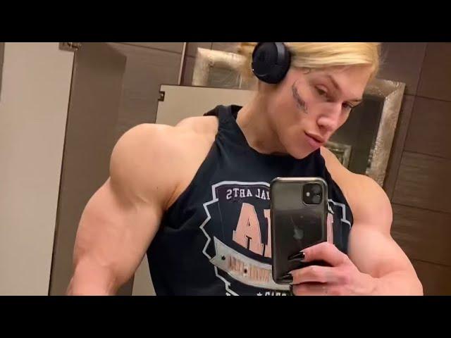 Beautiful muscular woman flexing muscles