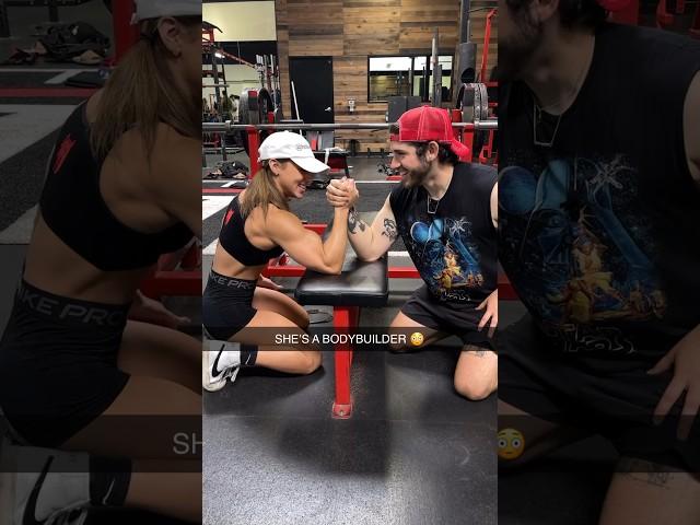 Arm wrestling a female bodybuilder 