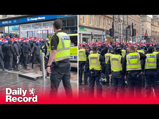 Rangers fans in Santa hats kettled on Union Street before Scottish League Cup Final against Celtic