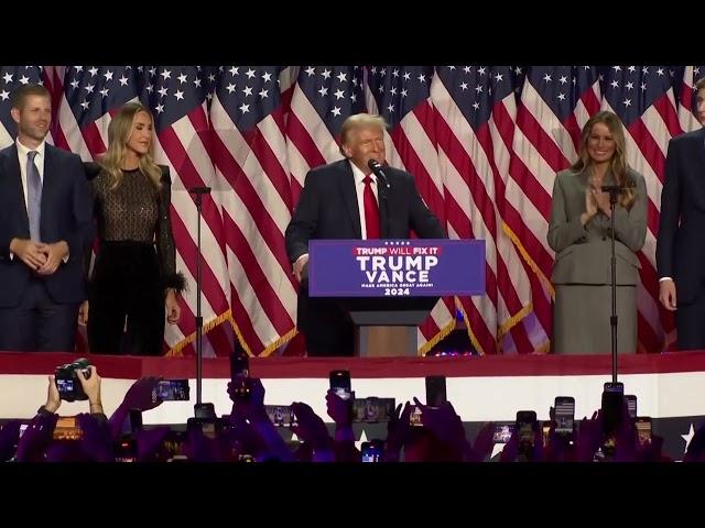 Donald Trump speaks at election night party flanked by family and friends