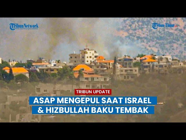 Asap mengepul saat Israel dan Hizbullah saling baku tembak di perbatasan Lebanon.