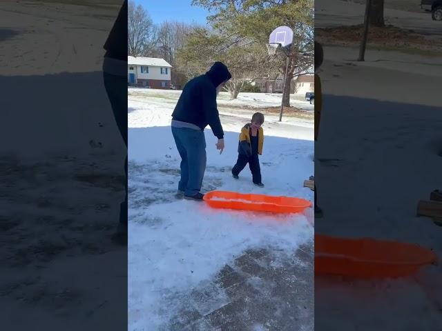 Here, hold my beer - Playing in the snow with one of the Grandsons