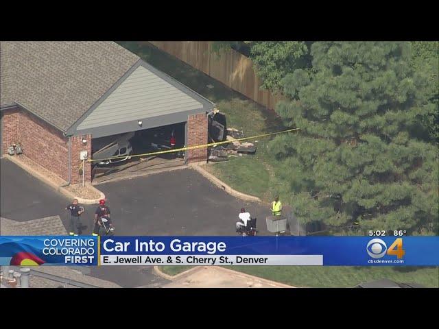 Vehicle Crashes Through Garage