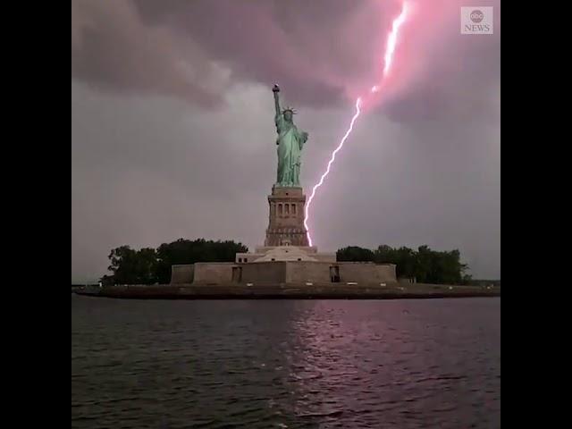 Statue of Liberty lit up by lightning