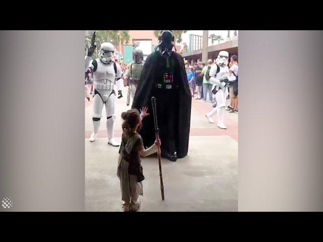 Four-year-old girl dressed as Rey meets Star Wars characters