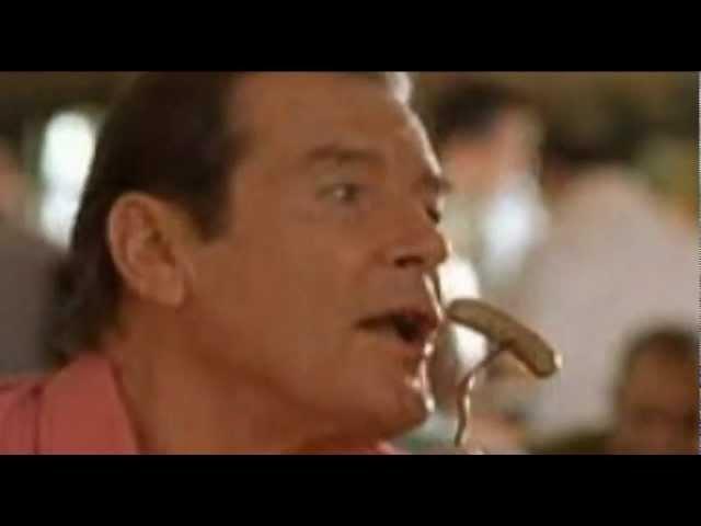 Roger Moore "fellating" a sausage