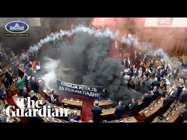 Flares and teargas thrown in Serbia's parliament amid protests