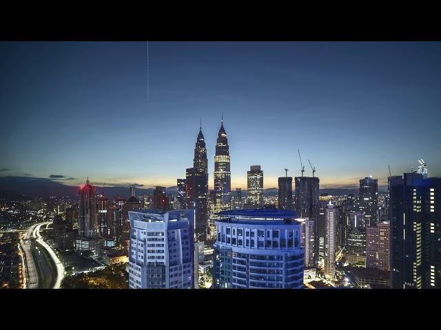 Star trail and Sunrise over Kuala Lumpur