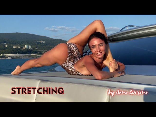 Stretching on a boat trip . Splits and back bends