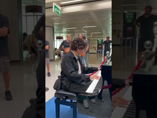 Playing Still Dre at the rome airport on a public piano!