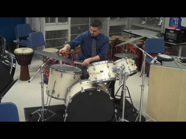 Ben Haines performing a latin drum beat on a drum set