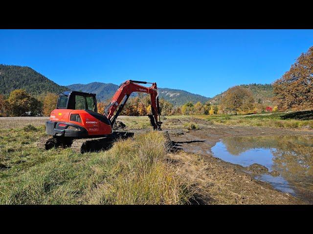 Beautiful day cow pond clean with the Kubota KX 080 4