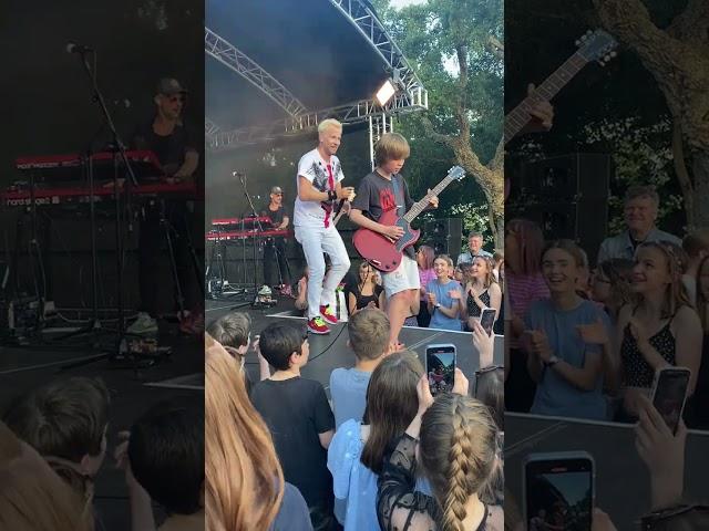 Can't believe this happened!  10 year old asks band at festival to let him play guitar..