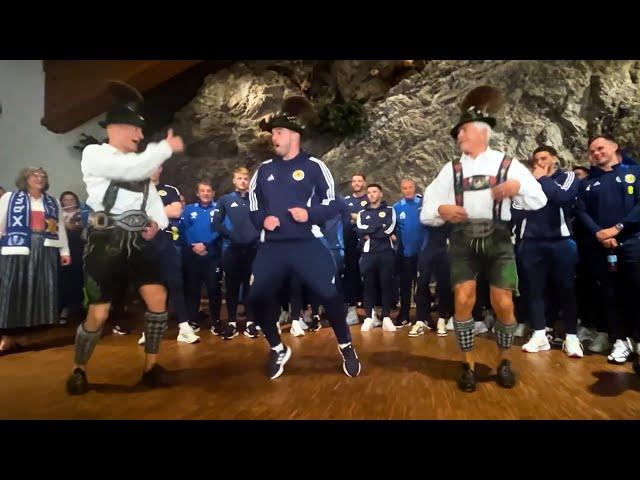 Moves like McGinn  Scotland midfielder throws some SHAPES on arrival in Germany