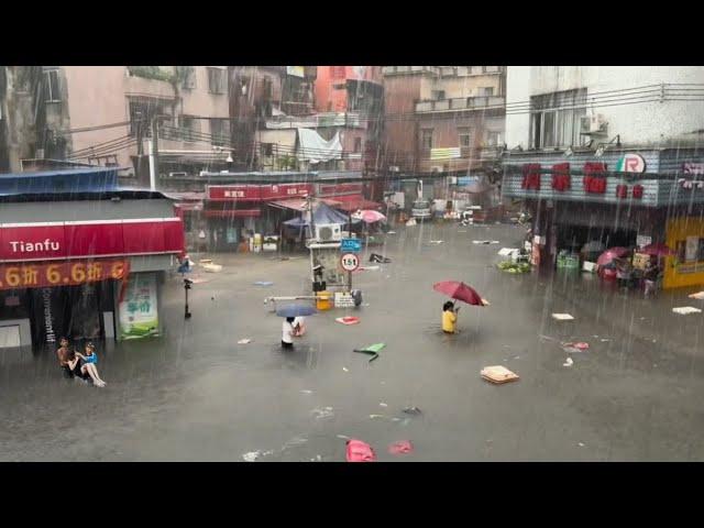 In China now! Hundreds of cars and buildings submerged, ship trapped under bridge in Guangdong