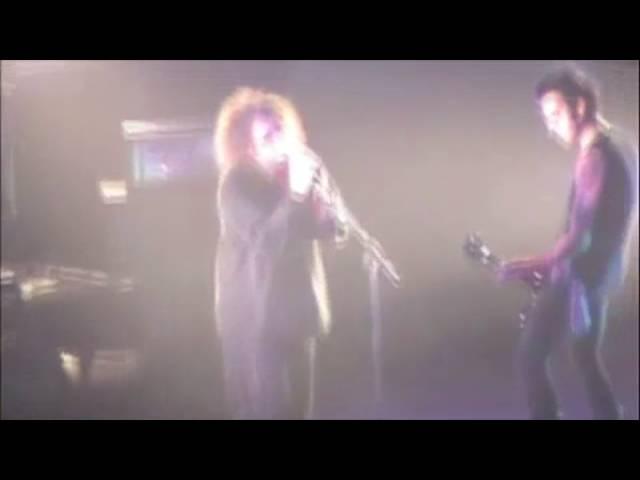 The Cure's Robert Smith sings with fan