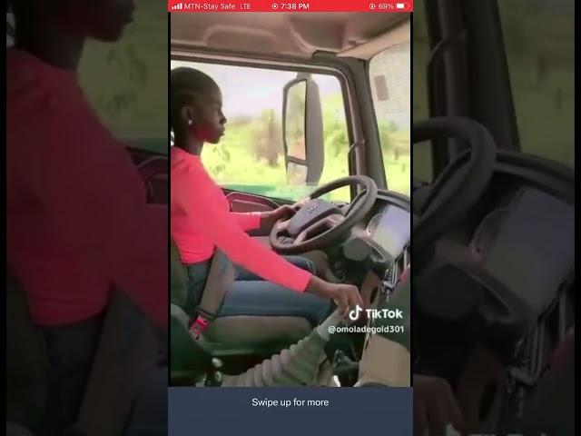 Young Girl Seen Driving A Long Trailer Truck.