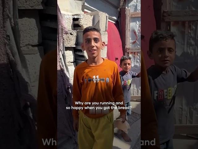 Palestinian boy celebrates first bread in two months