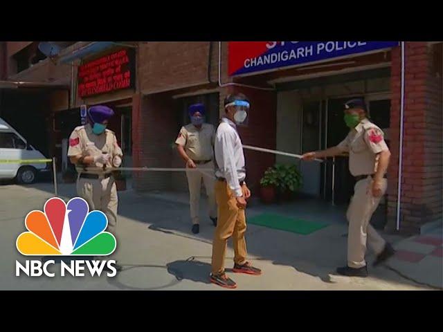 Indian Police Use 5 Foot Pole To Social Distance While Capturing Lockdown Offenders | NBC News NOW