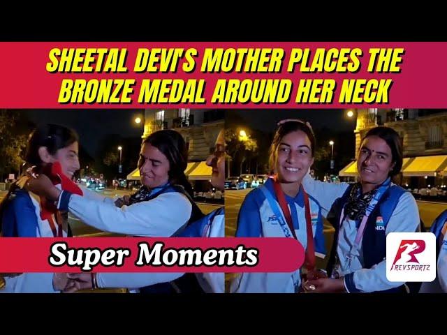 A heartwarming moment as Sheetal Devi's mother places the bronze medal around her neck