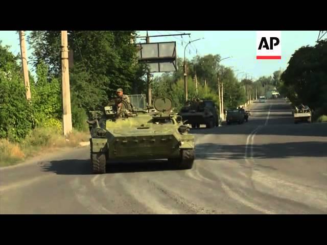 Armoured vehicles driven by pro-Russia rebels drive towards Krasnodon