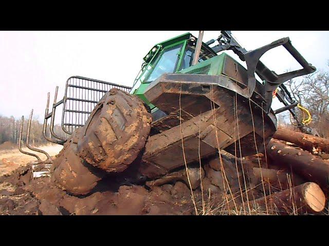 John Deere 810D stuck in  mud