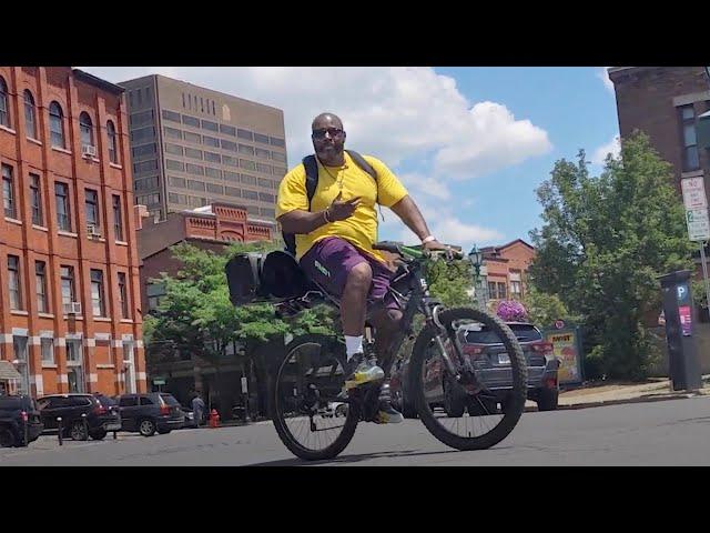 Boom box biker gets heads bopping in Syracuse