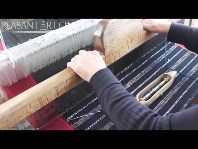 Romanian Woman Demonstrates Weaving a Traditional Skirt