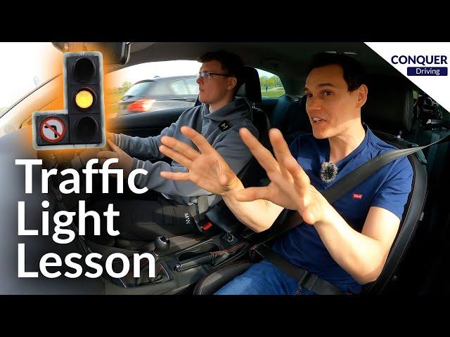 Driving Instructor Teaching a Pupil to Deal with Traffic Lights in Great Britain