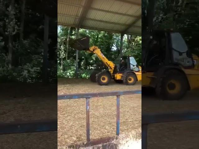 Scott in the JCB loading the trailer