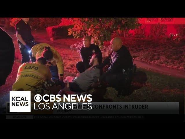 A Van Nuys homeowner detains an intruder after he breaks through glass doors at the home