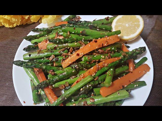 Stir fry butter garlic Asparagus with carrots.A side dish for dinner.