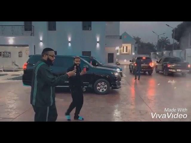 E-money admires his convoy from his house