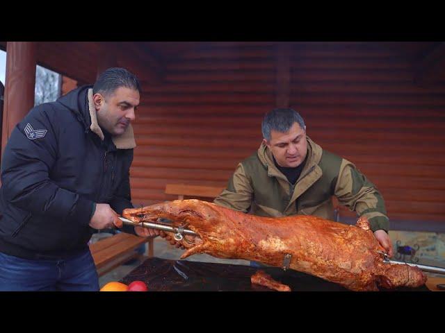 We cook a huge 24 kg ram whole on a spit.