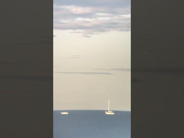 Stranded sailboat off Pt. Au Gres being towed