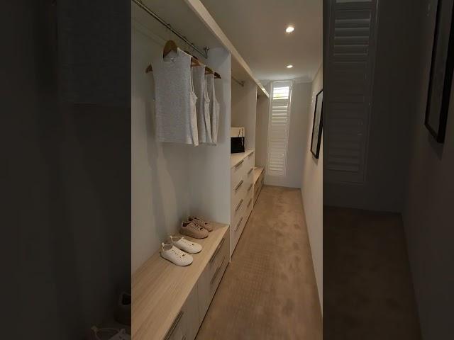 Bedroom with connected bathroom and walk-in