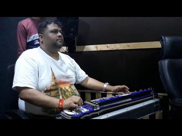 Dhananjay Mishra ji,India's famous music director,playing Banjo in a Recording.