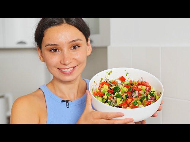 Incredibly delicious simple salad with tomatoes, cucumbers and avocados