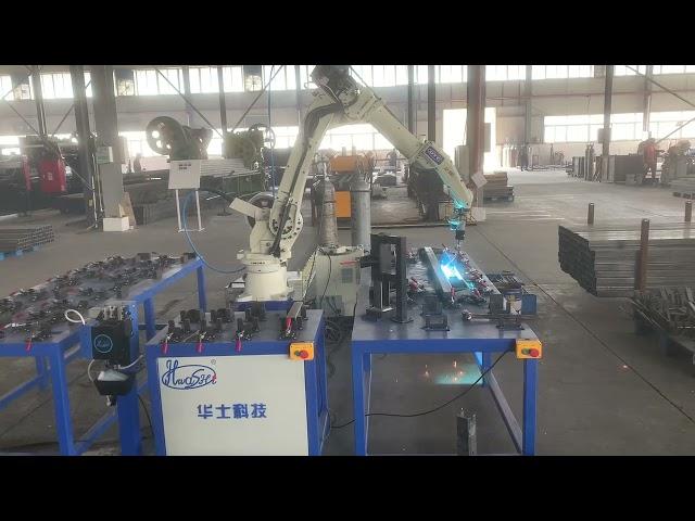 OTC mig robotic welding arm, three workstations