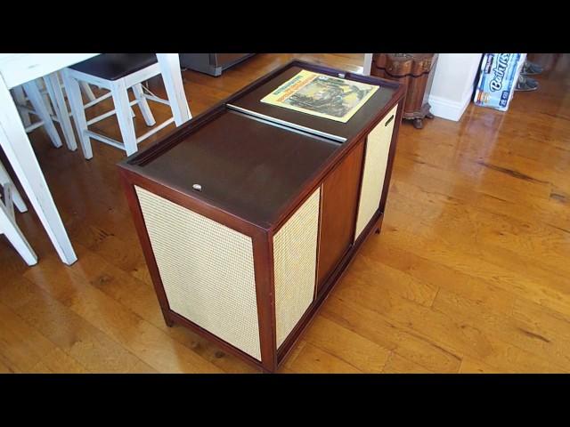 Columbia C1459, console STEREO record player playing a LP record