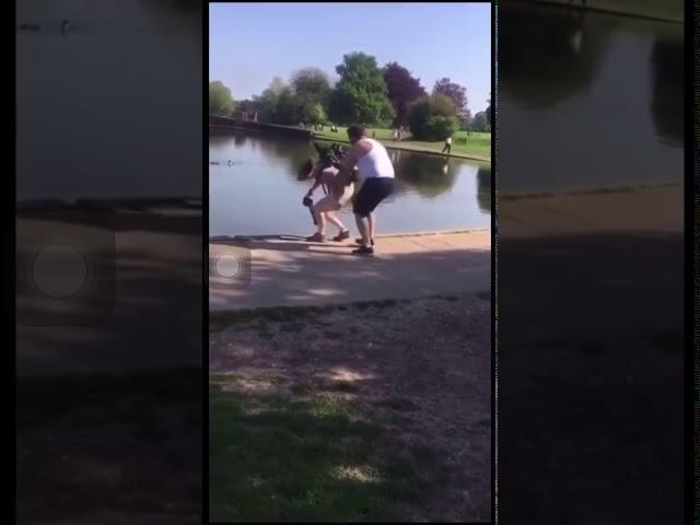 Guy pushes photographer into pond