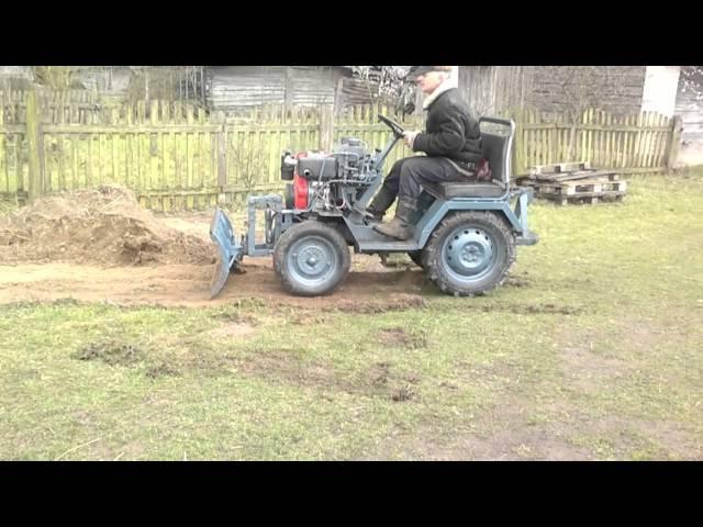 homemade bulldozer to the tractor