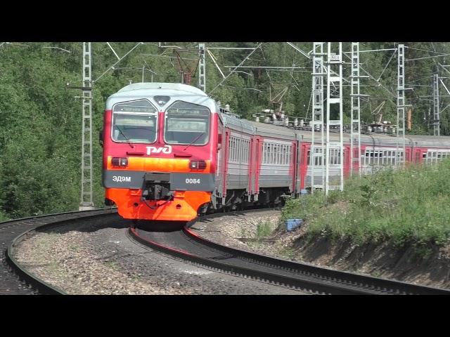 Russian freight and passenger trains in the summer. Siberia