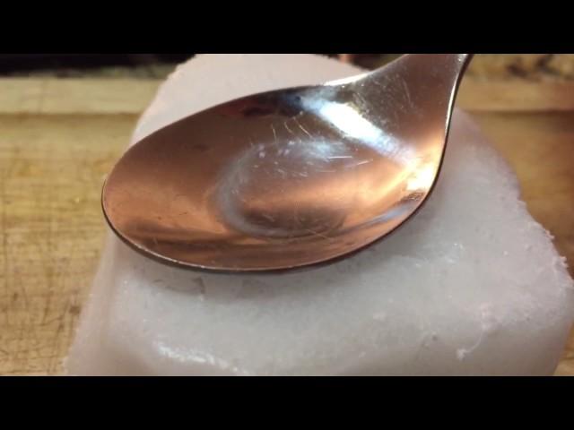 Water freezes and cracks on spoon (not sped up)