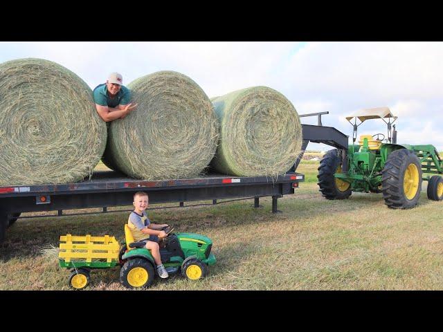 Moving hay bales around the farm | Tractors working for kids