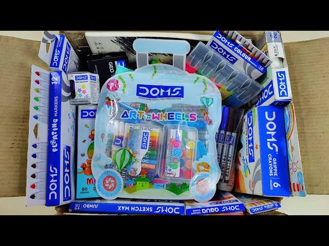 Box full of doms stationery items - art on wheels kit, colour pencils, wax crayons, clay, colour pen