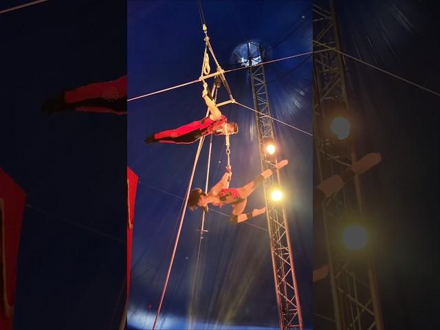 Extreme Trapeze Act: Woman Spins from Tow Handle While Partner Hangs by Neck! #circus #trapeze #fair