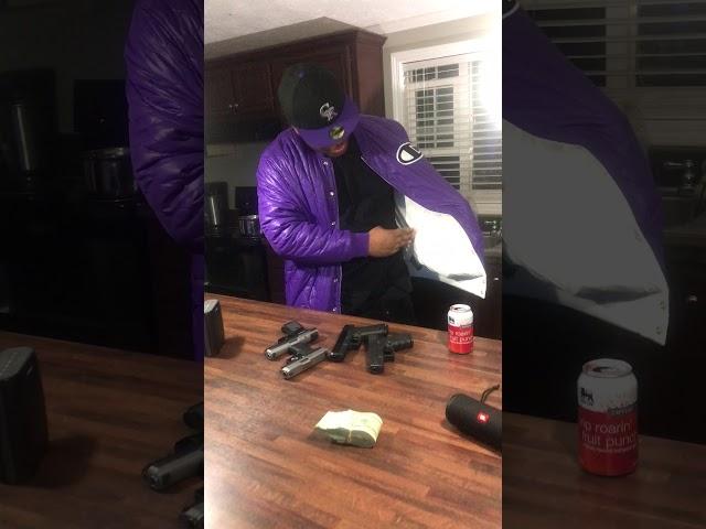 RAPPER HITMANFLOYD PULL  100 GUNS OUT A JACKET ON SET OF GUCCI GANG 