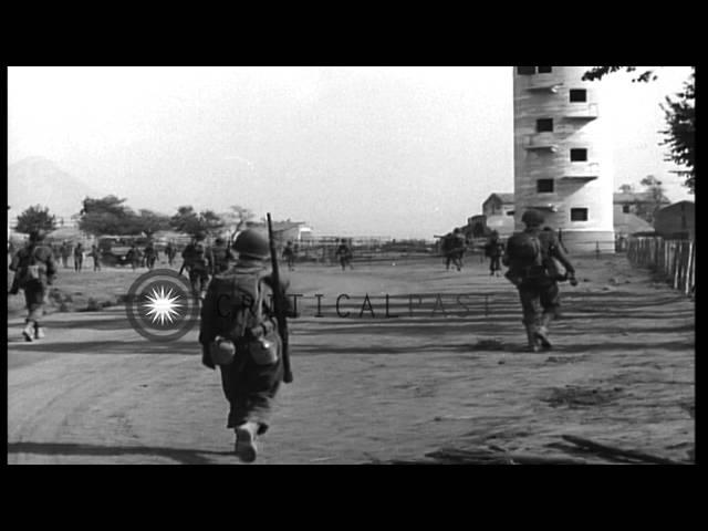 US Army soldiers recover German Panzer III Ausf L Flamethrower tank, in a village...HD Stock Footage